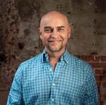 A headshot of Craig Cartwright